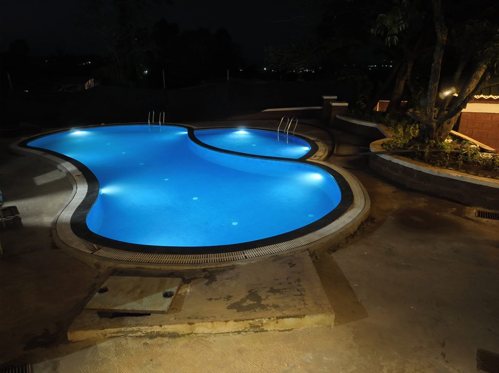 Enjoy a luxurious swim in Prathamesh Valley Resort's pool