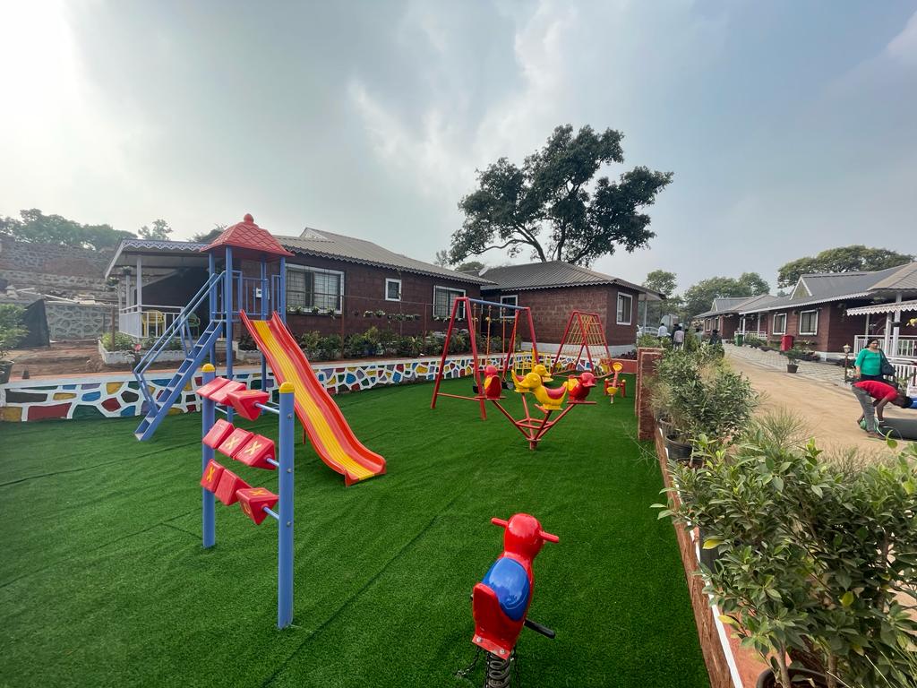 Children's play area with scenic view at Prathamesh Valley Resorts.